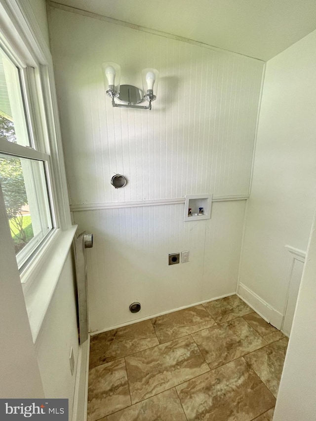 clothes washing area with laundry area, hookup for a washing machine, and hookup for an electric dryer