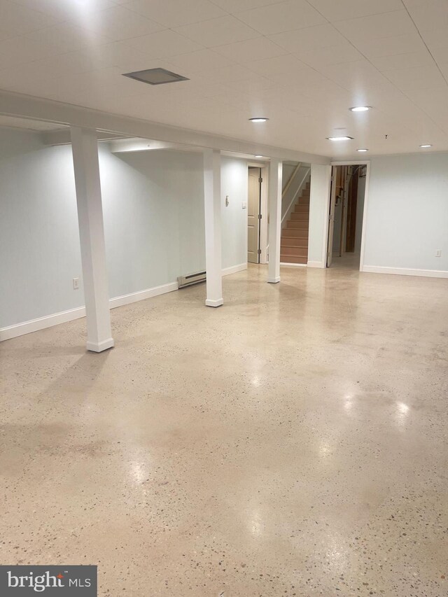 basement featuring a baseboard radiator