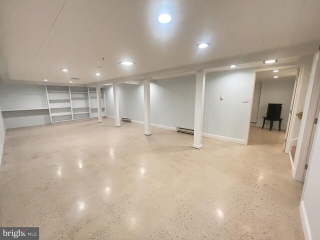 basement featuring a baseboard radiator