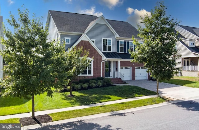 view of front of home featuring an attached garage, concrete driveway, brick siding, and a front yard