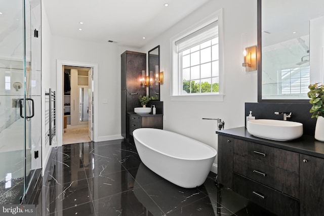 full bath featuring a freestanding tub, visible vents, vanity, marble finish floor, and a shower stall