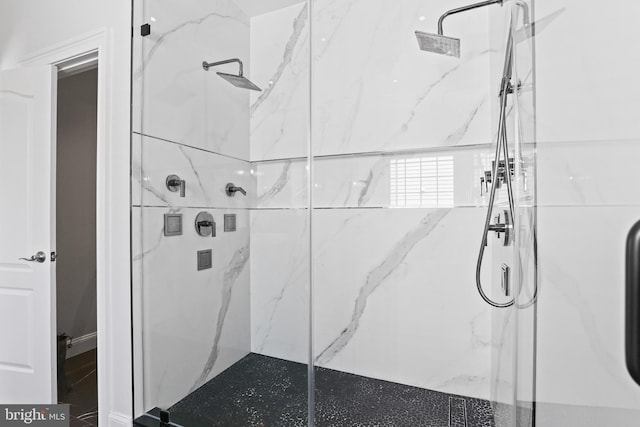 full bathroom featuring a marble finish shower