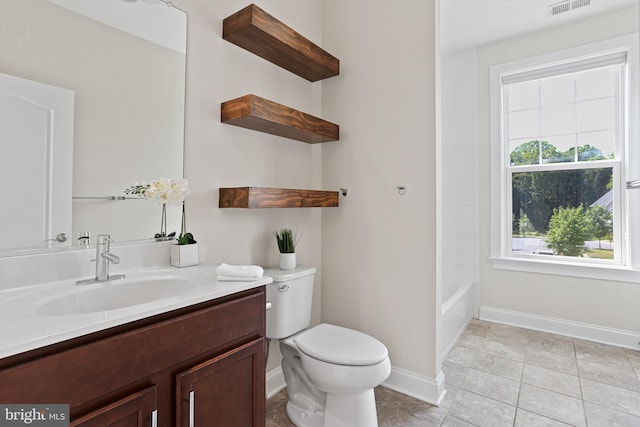 full bath with toilet, vanity, baseboards,  shower combination, and tile patterned floors