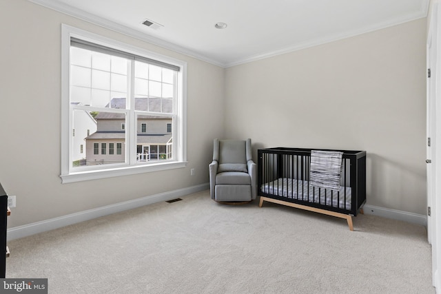 bedroom with baseboards, ornamental molding, visible vents, and light colored carpet