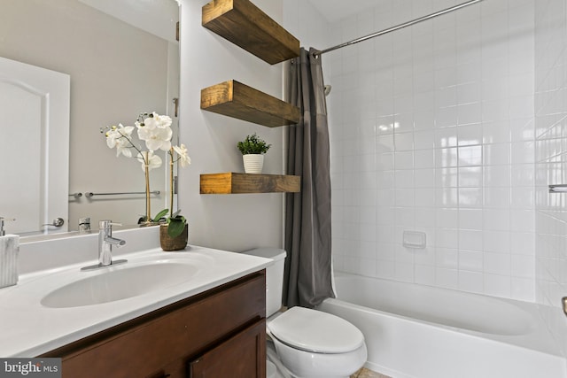 bathroom featuring vanity, toilet, and shower / bath combo with shower curtain