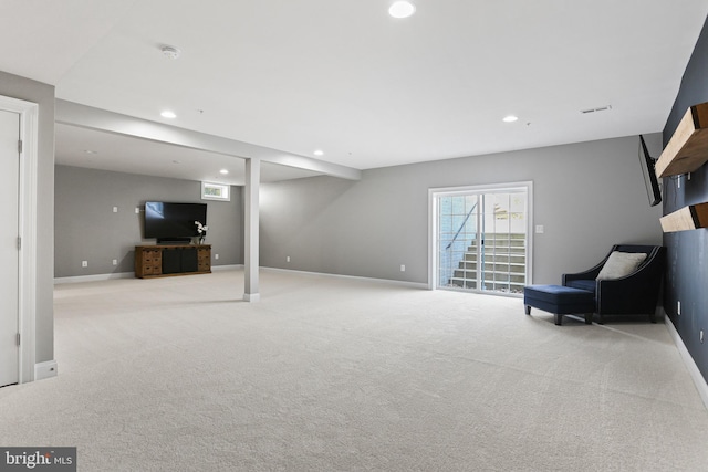 interior space with recessed lighting, light colored carpet, and baseboards