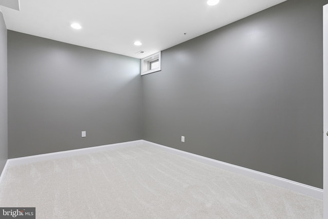 below grade area featuring baseboards, carpet floors, and recessed lighting