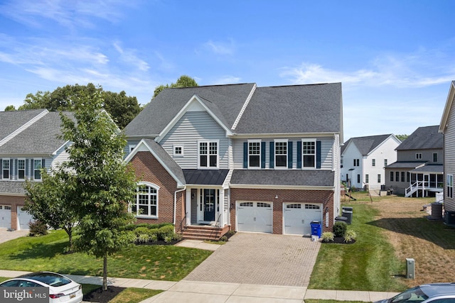 view of front of property with a shingled roof, an attached garage, decorative driveway, a front lawn, and brick siding