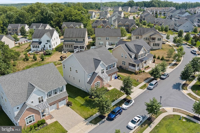 birds eye view of property with a residential view