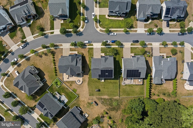 birds eye view of property with a residential view