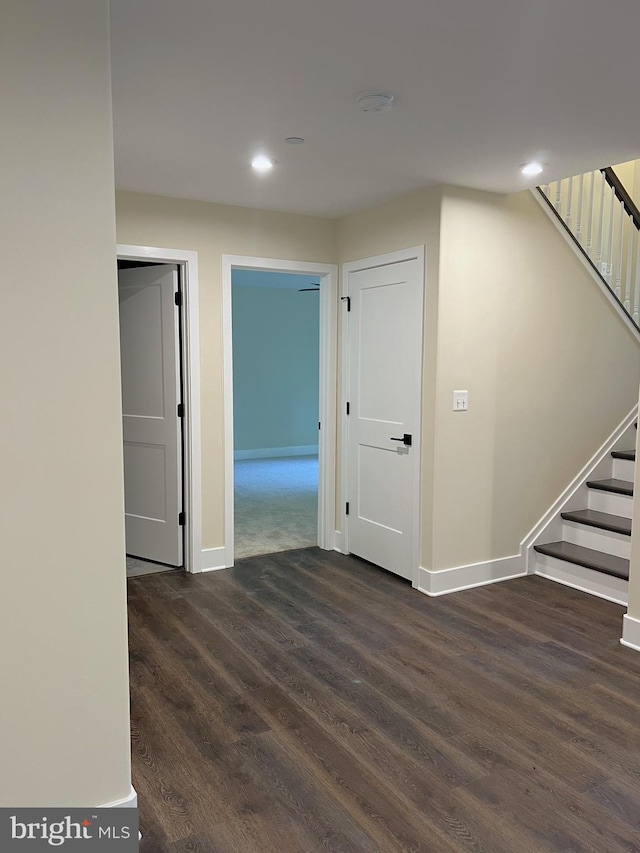 corridor with dark hardwood / wood-style floors