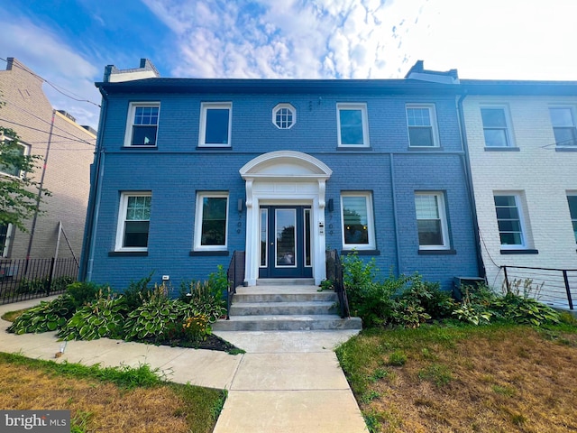 view of front of home featuring cooling unit