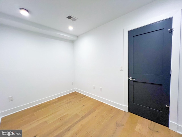 unfurnished room with light hardwood / wood-style floors