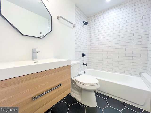 full bathroom with vanity, tiled shower / bath, and tile patterned flooring