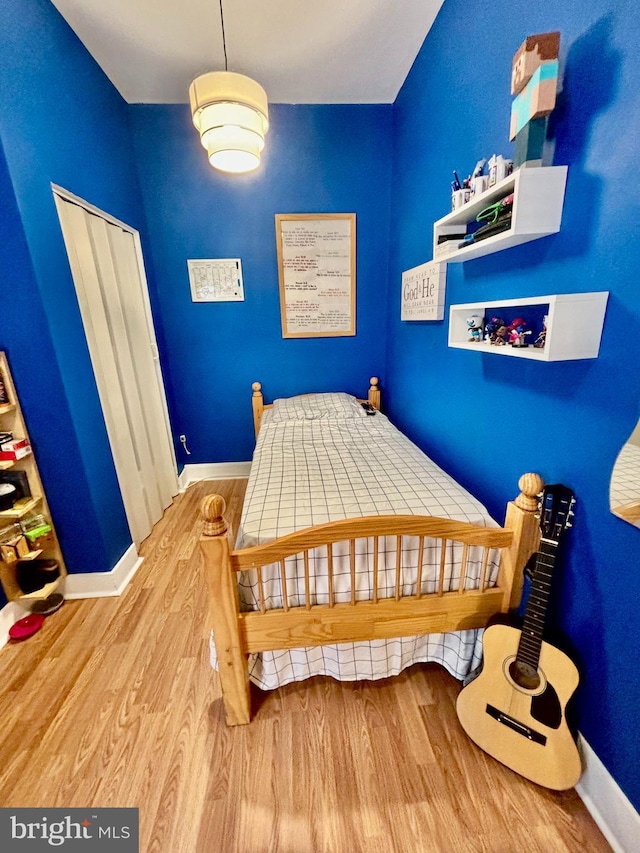 bedroom with hardwood / wood-style floors