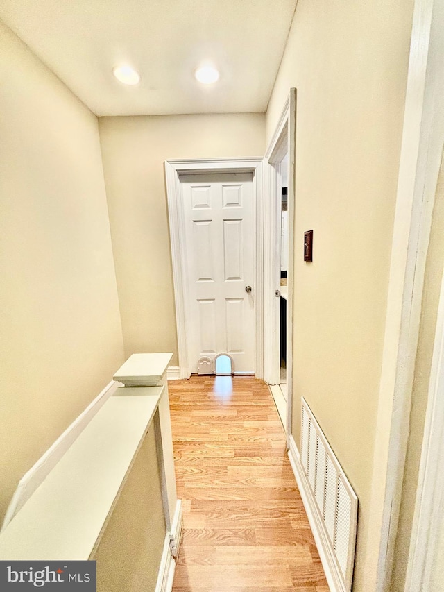 corridor featuring light hardwood / wood-style floors