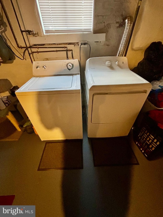 washroom featuring independent washer and dryer