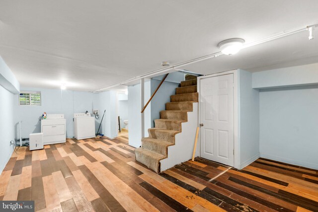 basement featuring hardwood / wood-style flooring and washer and clothes dryer