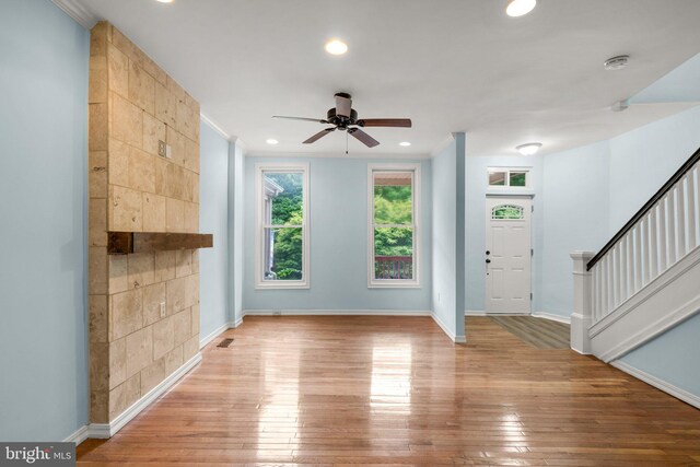 entryway featuring ceiling fan and light wood-type flooring