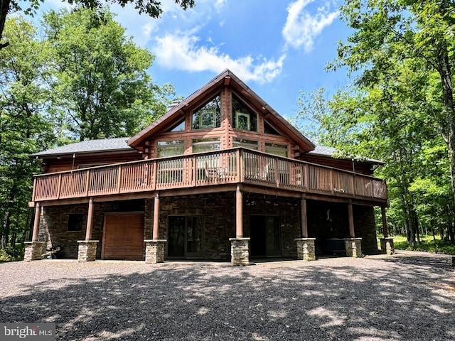 cabin with a wooden deck