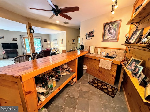 interior space featuring sink, tile patterned floors, ceiling fan, and track lighting