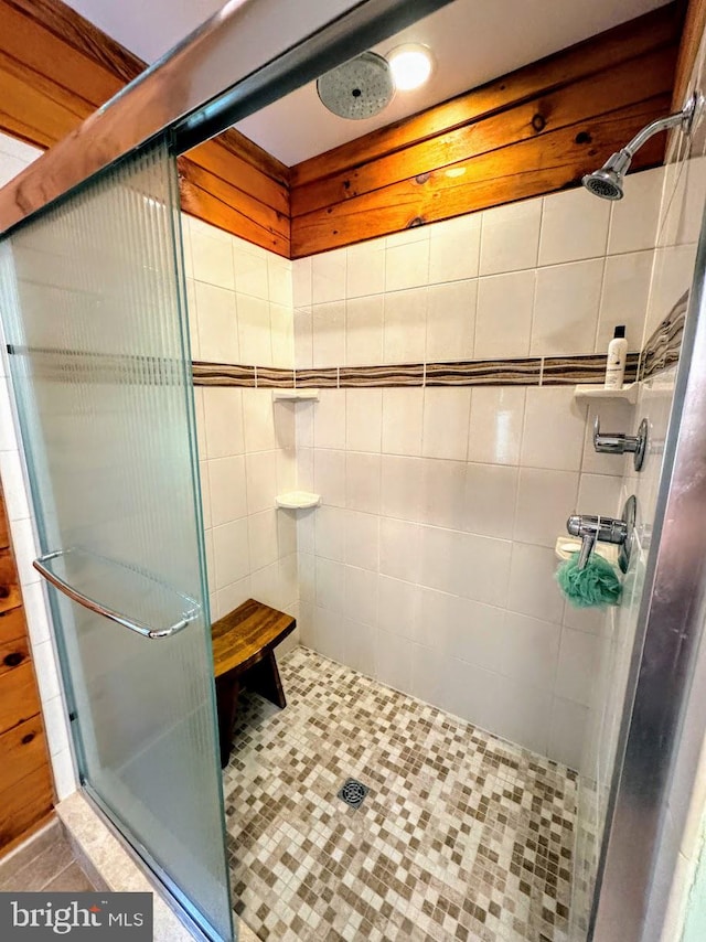 bathroom featuring tile patterned flooring and a shower with shower door