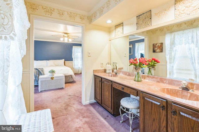 bathroom featuring ceiling fan, vanity, and ornamental molding