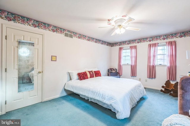 bedroom with ceiling fan and carpet