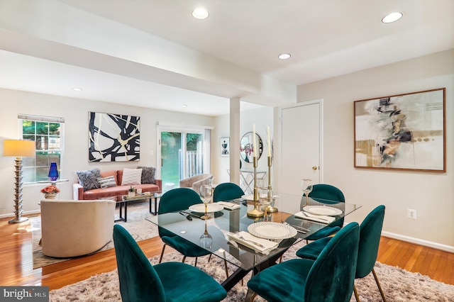 dining room featuring light wood finished floors, recessed lighting, and baseboards