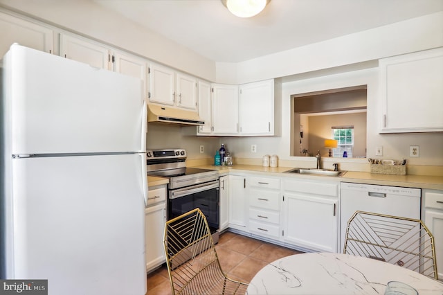 kitchen featuring light countertops, white cabinetry, a sink, white appliances, and under cabinet range hood