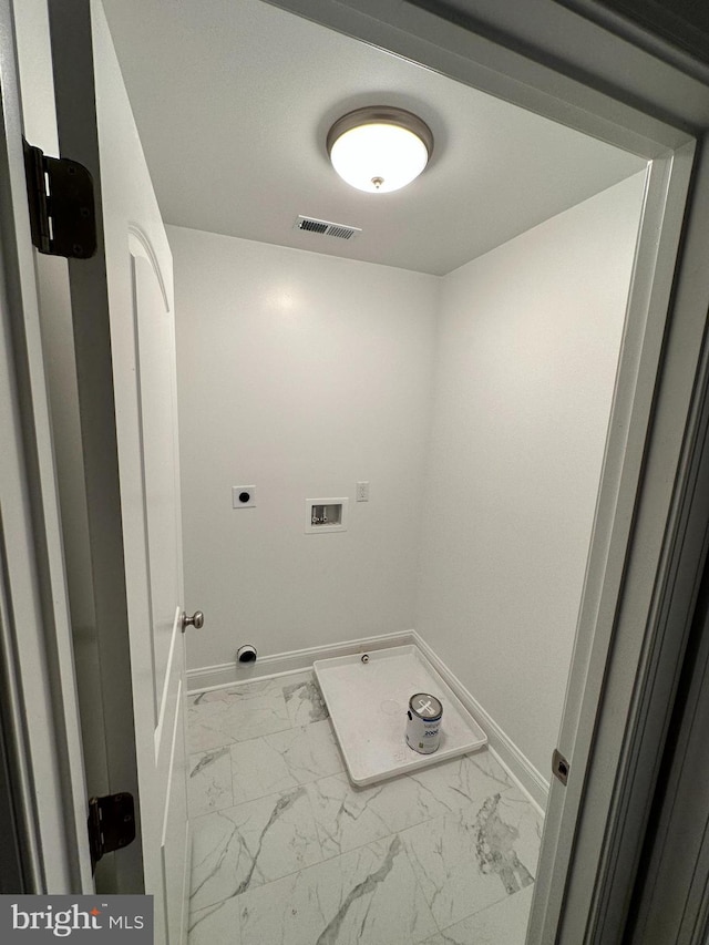 laundry area featuring electric dryer hookup and washer hookup