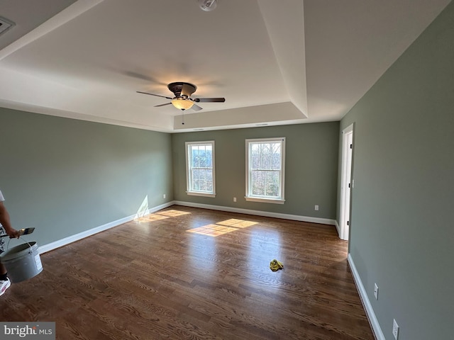 715 Parishville Rd, Gore, VA 22637 - spare room featuring dark wood-style flooring, baseboards, a ceiling fan, and a raised ceiling