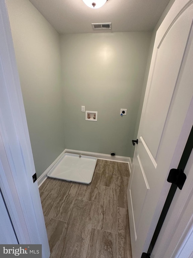 715 Parishville Rd, Gore, VA 22637 - laundry area with hookup for an electric dryer, washer hookup, baseboards, and laundry area