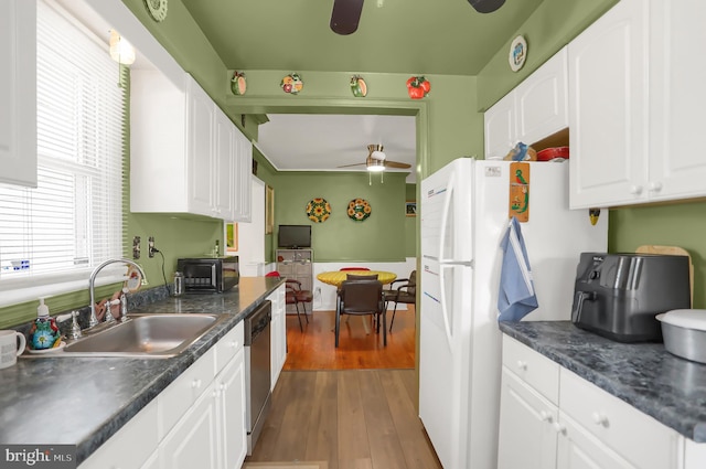 kitchen featuring sink, stainless steel dishwasher, dark hardwood / wood-style flooring, ceiling fan, and white cabinets