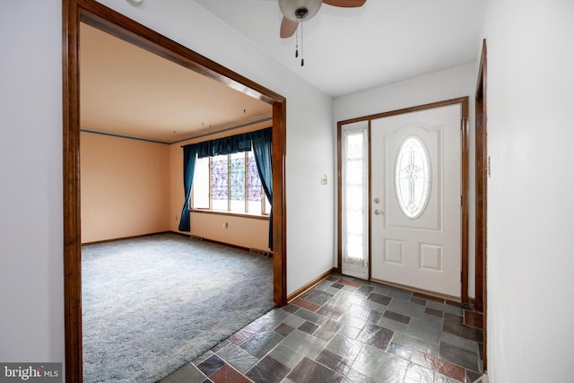 tiled foyer entrance with ceiling fan