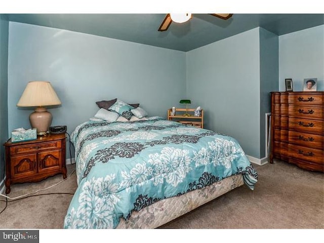 bedroom featuring ceiling fan and light colored carpet