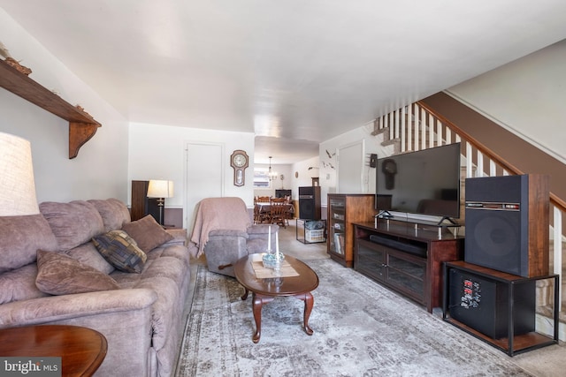 living room featuring a chandelier