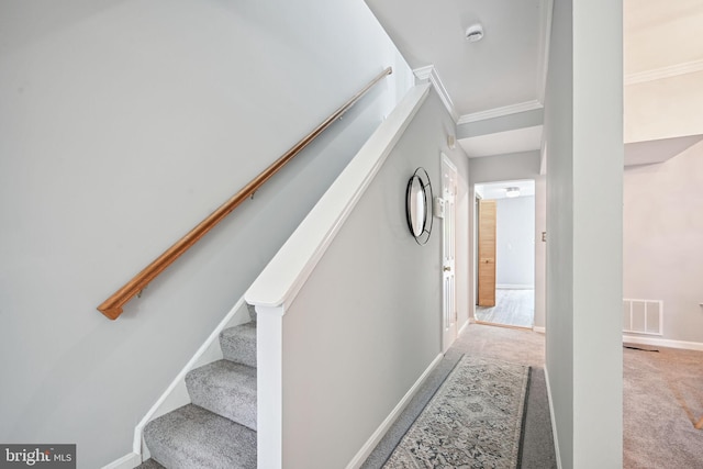 hall with light carpet and crown molding