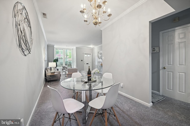 dining space featuring ornamental molding, carpet floors, and a notable chandelier