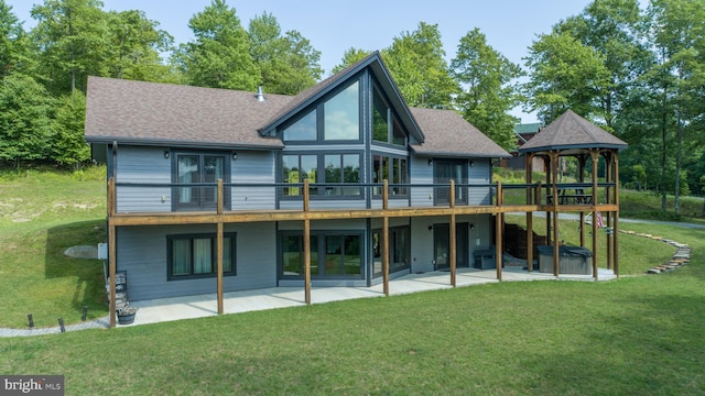 rear view of house with a patio, a gazebo, a yard, and a wooden deck