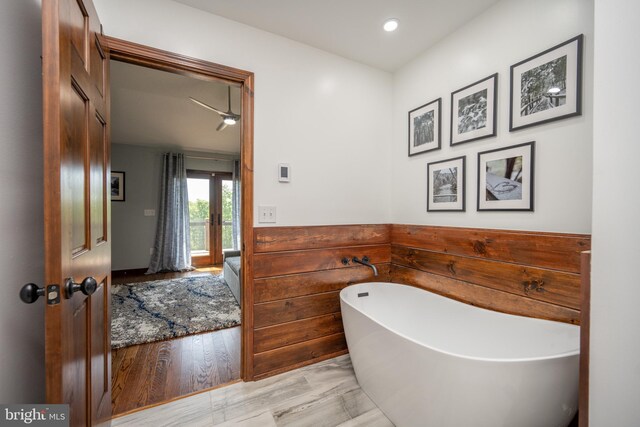 bathroom featuring ceiling fan and hardwood / wood-style floors