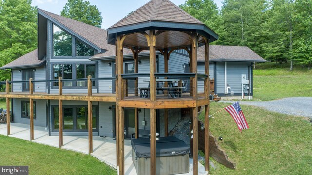 rear view of property with a patio area and a yard