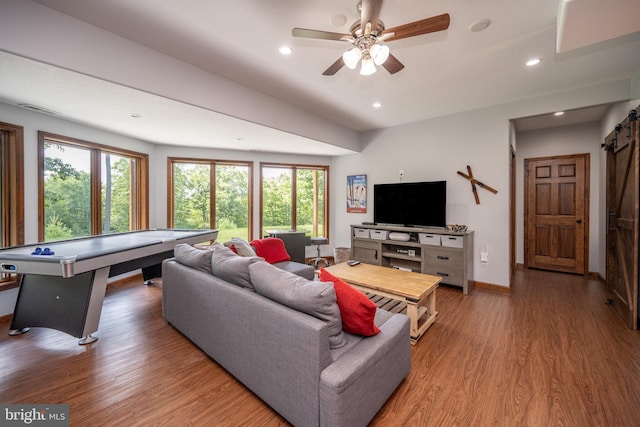 living room with ceiling fan, hardwood / wood-style flooring, and a wealth of natural light