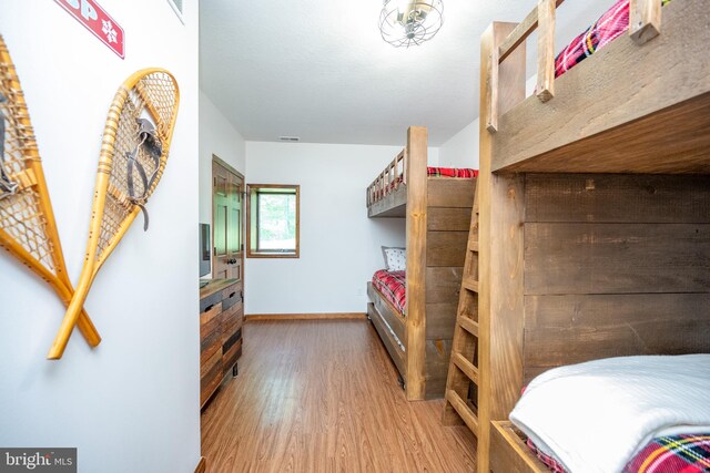 bedroom with hardwood / wood-style flooring