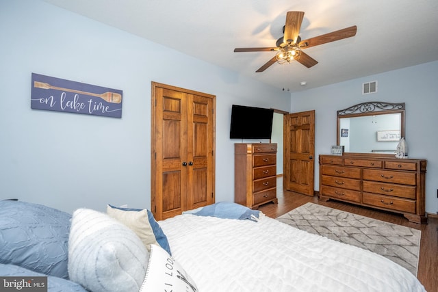 bedroom with ceiling fan and light hardwood / wood-style flooring