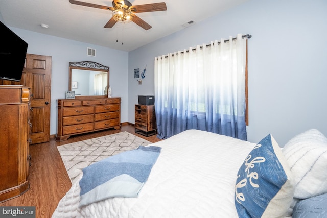 bedroom with hardwood / wood-style flooring and ceiling fan