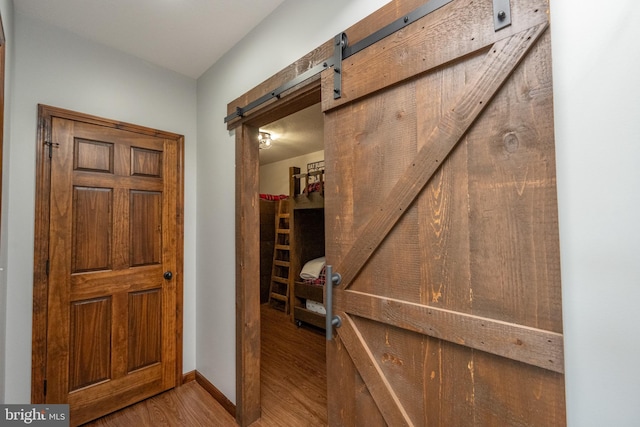 entryway featuring wood-type flooring and a barn door