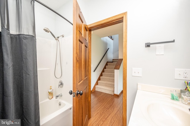 bathroom featuring sink, shower / bath combo, and hardwood / wood-style floors