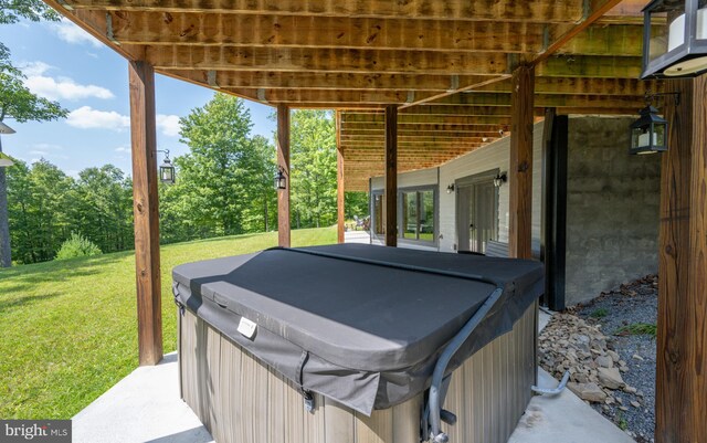 view of patio with a hot tub