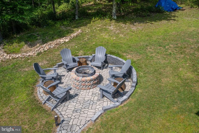 view of yard with an outdoor fire pit